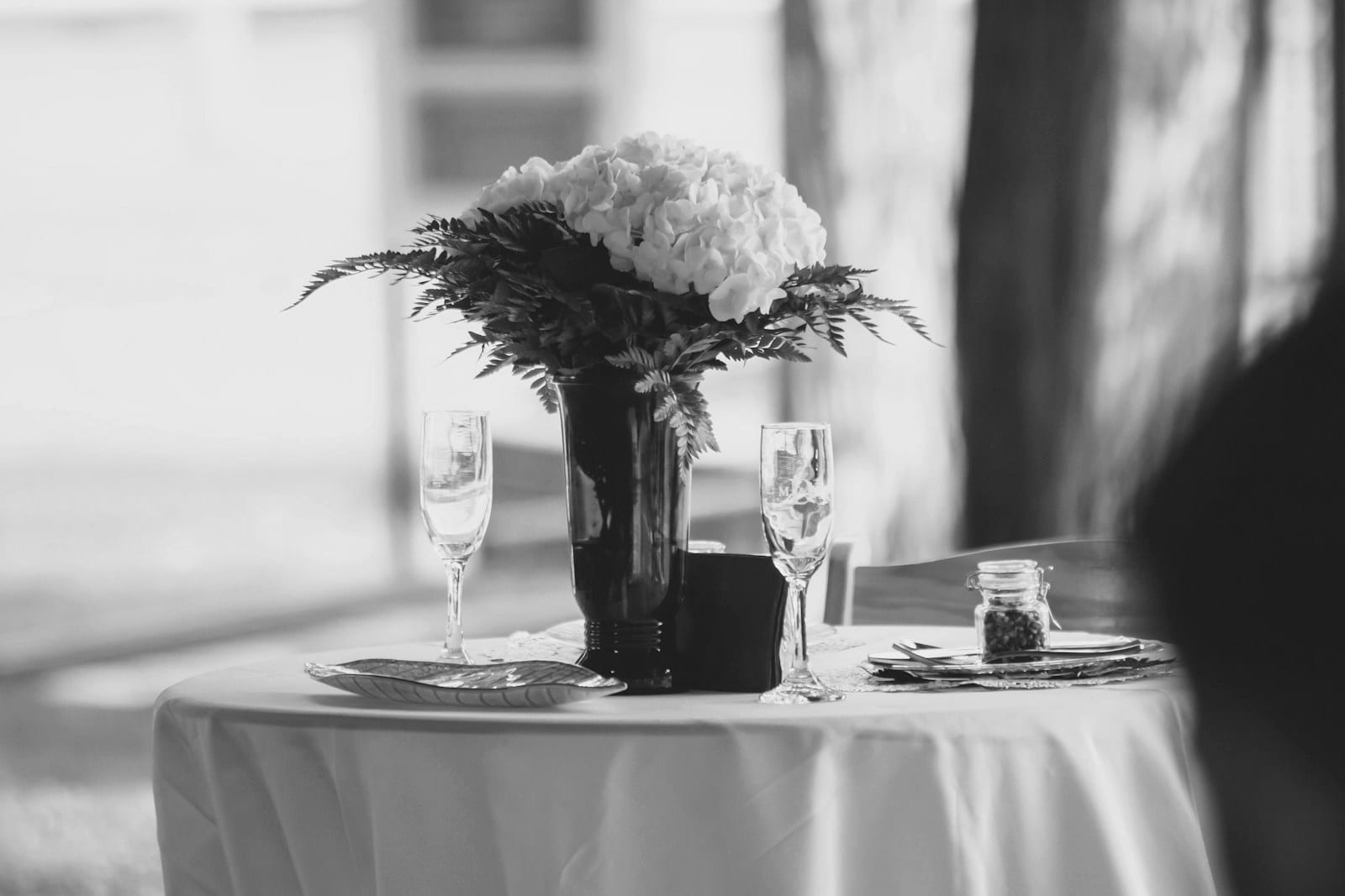 Floral centrepiece with champagne glasses